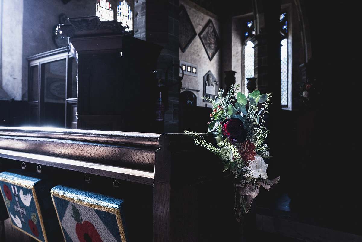 flower arrangement brown wooden table church